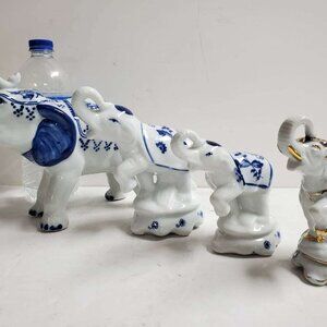Set of 4 Elephant Figurines with Delft-like Blue and Gold Accents
